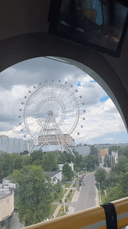 Moscow Ferris wheel offers cityscape view with pedestrians below