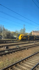 Passenger train travels through Riga railway system early morning