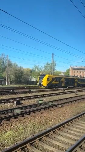 Passenger train travels through Riga railway system early morning