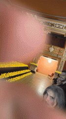 Individual explores ornate theater interior in Sofia, Bulgaria