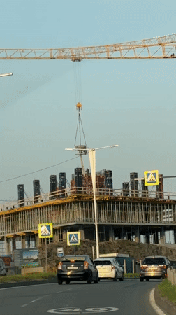 Construction crane operates near university campus on Russky Island