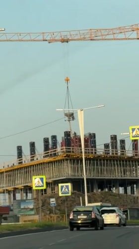 Construction crane operates near university campus on Russky Island