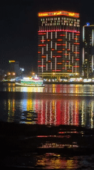 Evening street life and illuminated landmarks captured in Đà Nẵng