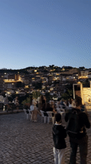 Evening scenes across historic Veliko Tarnovo with monuments and music