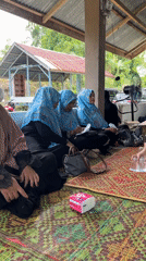 Women gather at outdoor pavilion in Lhokseumawe, Indonesia