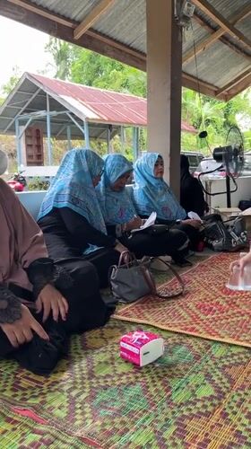 Women gather at outdoor pavilion in Lhokseumawe, Indonesia