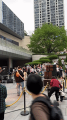 Band performs outdoor concert in busy Jiulongpo District plaza
