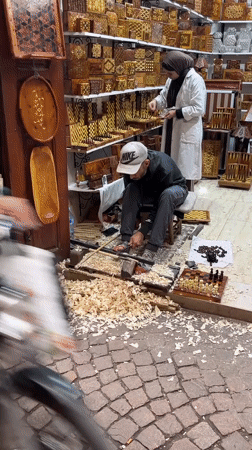 Woodworking shop activity captured in Marrakesh souk