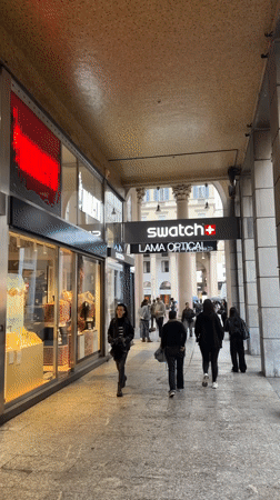 Morning activity captured at Milan luxury shopping arcade