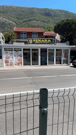 Car displays Montenegro flag while driving through Sutomore