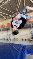 Young gymnast practices flips at Krasnoyarsk gymnasium