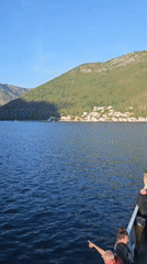 Ferry crosses Montenegro waters with cars and passengers aboard