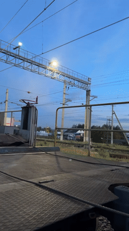 Group gathers on railroad tracks as trains pass in Russia