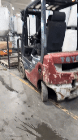 Warehouse operations documented in Perm with forklift and bicycles