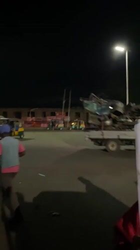 Nighttime street market bustles with vendors and diners in Bukuru