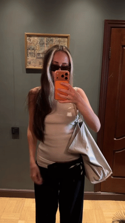 Woman takes mirror selfies in Khimki room