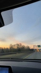 Driver records highway sunset view in Delta, Canada
