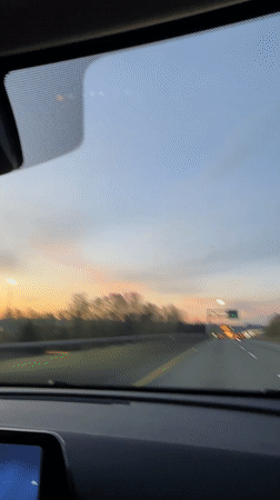 Driver records highway sunset view in Delta, Canada