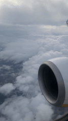 Passenger captures dawn views above clouds near Budapest