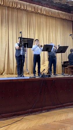 Community cultural performance features trumpeters and ballet dancers in Ukraine