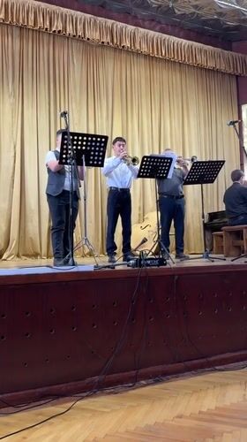Community cultural performance features trumpeters and ballet dancers in Ukraine