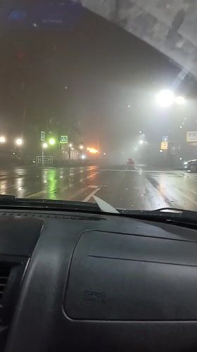 Night driving through foggy wet streets in Sarapul, Russia