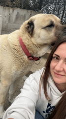 Woman takes selfie with dog in Varna, Bulgaria