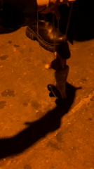 Street puppeteer performs with marionette in Buenos Aires