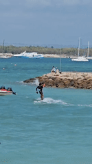 Kitesurfer hits aerial tricks off the Bali coast