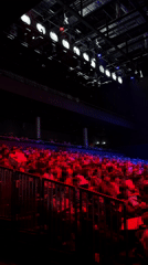 Theater audience watches cardboard robot performance in Berlin