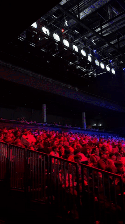 Theater audience watches cardboard robot performance in Berlin