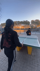 Evening table tennis match observed in Buenos Aires park