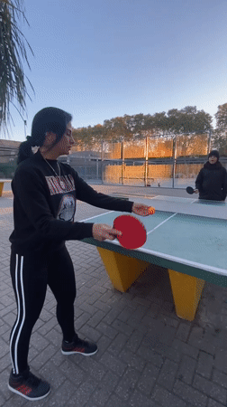 Evening table tennis match observed in Buenos Aires park
