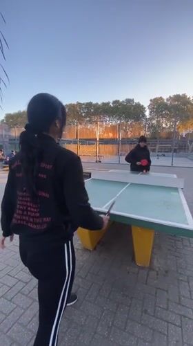 Evening table tennis match observed in Buenos Aires park
