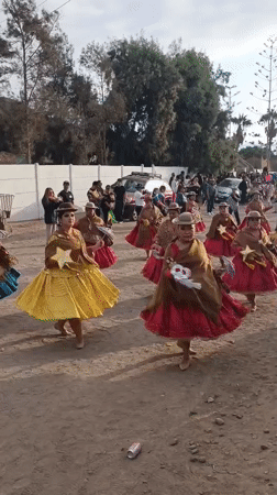 Traditional dance troupes and brass bands parade through Arica, Chile