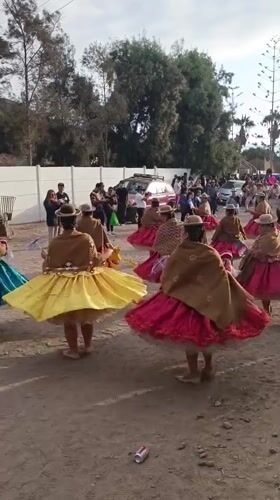 Traditional dance troupes and brass bands parade through Arica, Chile