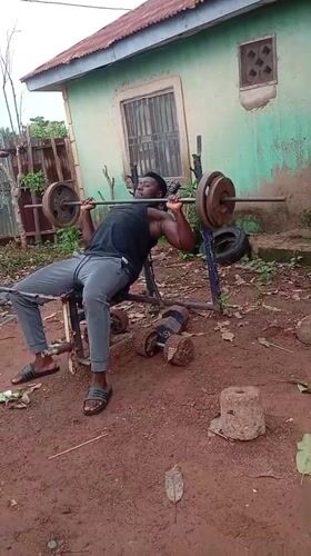 Man conducts outdoor weightlifting session in Akwanga, Nigeria