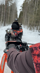 ATV riders explore snowy forests near Izluchinsk, Russia