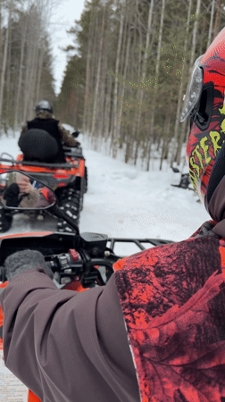 ATV riders explore snowy forests near Izluchinsk, Russia