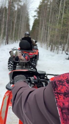 ATV riders explore snowy forests near Izluchinsk, Russia