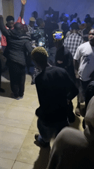 Indoor party with dancing, drumming and rapping in Nigeria