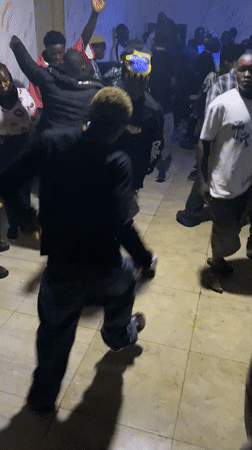 Indoor party with dancing, drumming and rapping in Nigeria