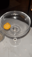 Empty cocktail glass with orange garnish spotted in Sofia