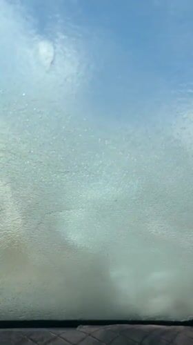 Man washes car at self-service station in Fethiye