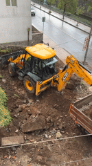 Construction crew loads dirt truck in Zlatograd, Bulgaria