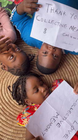 Children in Jos create thank-you signs for Collective Memory