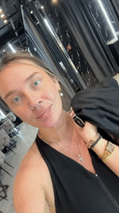 Woman takes selfies at Ukrainian nail salon
