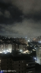 Caracas nighttime cityscape captured under cloudy skies early morning