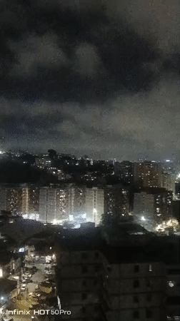 Caracas nighttime cityscape captured under cloudy skies early morning