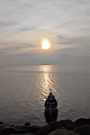 Traditional boat spotted at dawn in Lhokseumawe coastal waters